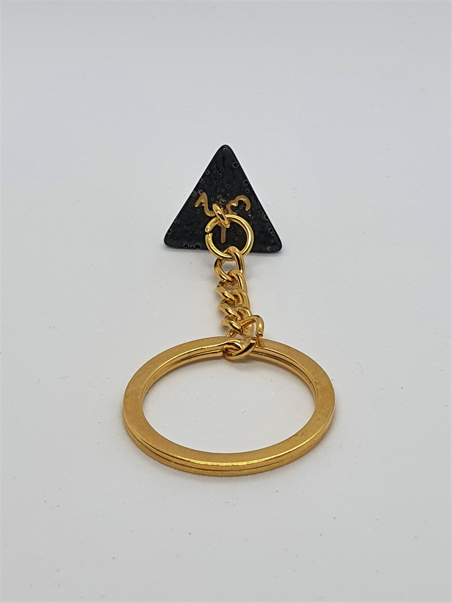 Porte-clés D4 noir et or - Le Chat Pipé
